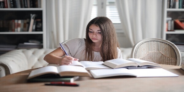 Student making handwritten notes to start her for UPSC (IAS) exam preparation.